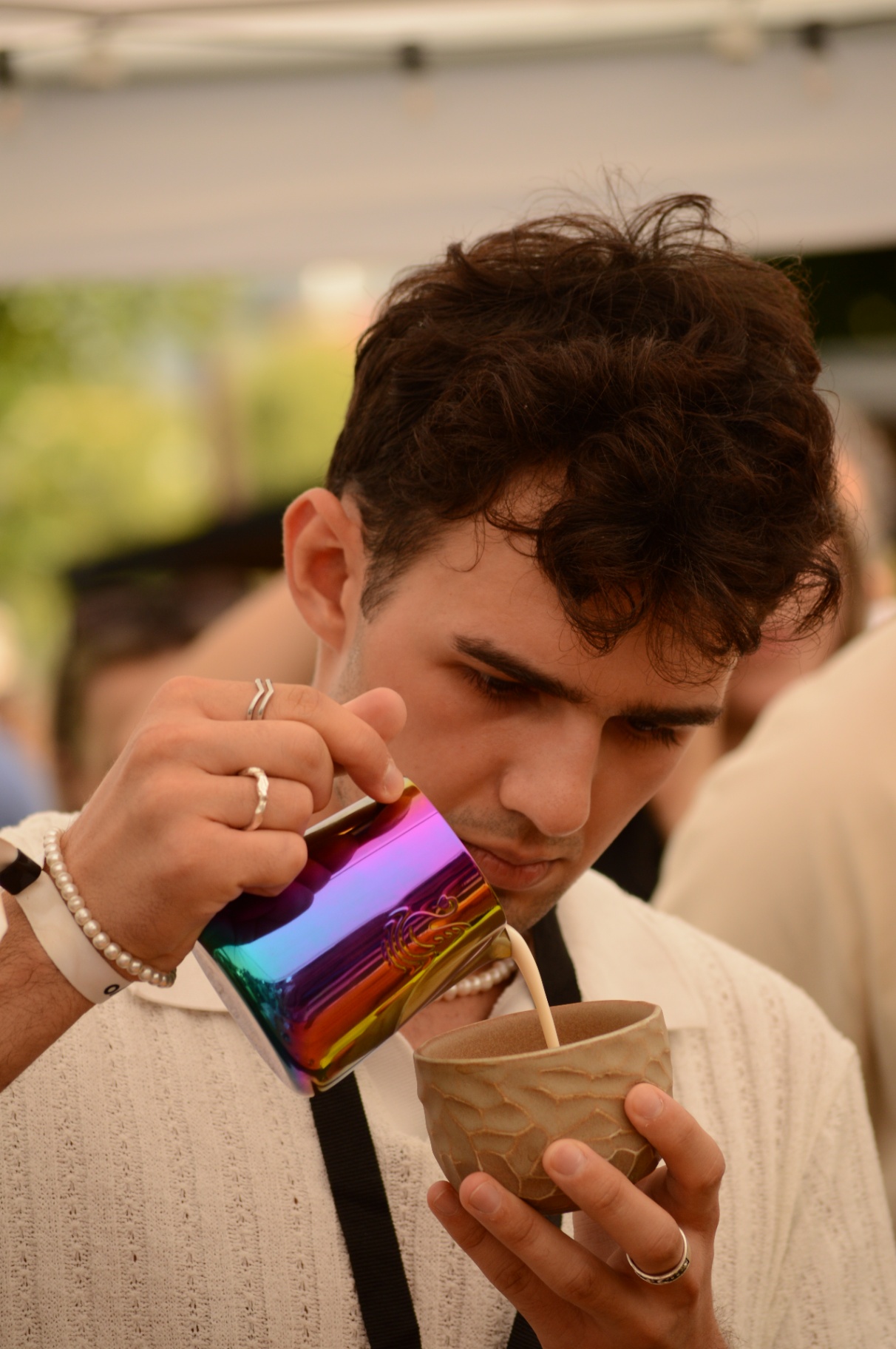 Barista pouring latte art